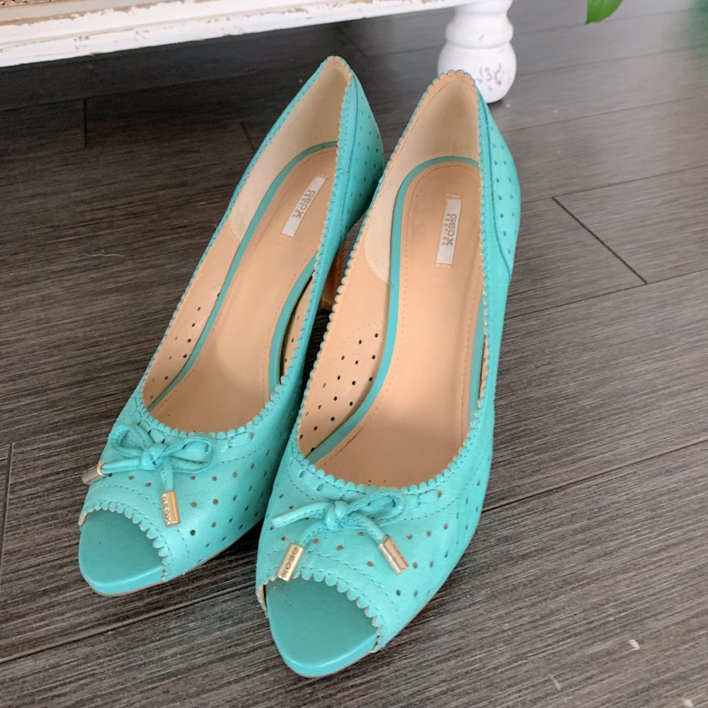 Turquoise blue pumps with the most comfortable walking heel.
